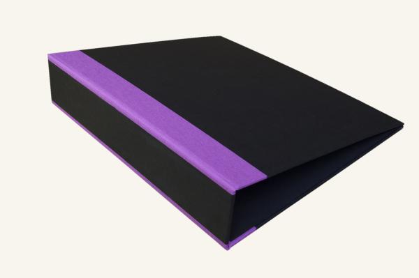 black folder with purple linen corners